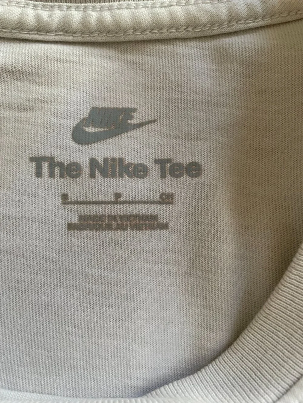 The Nike Tee With Two Red and Black Embroidered Logo - Size S